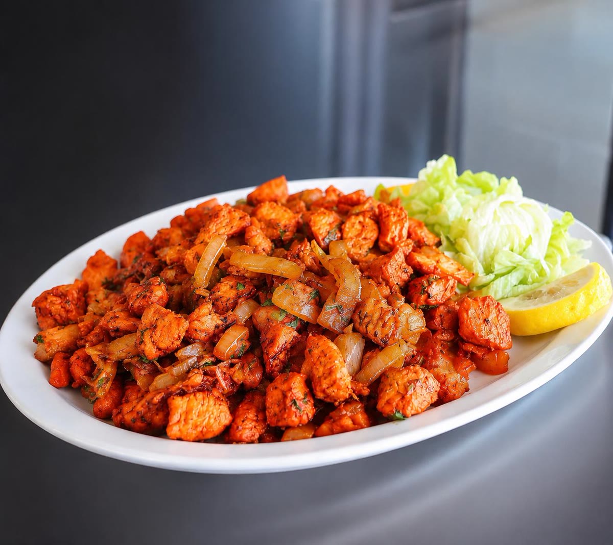 Chicken suqaar plate with lettuce and lemon